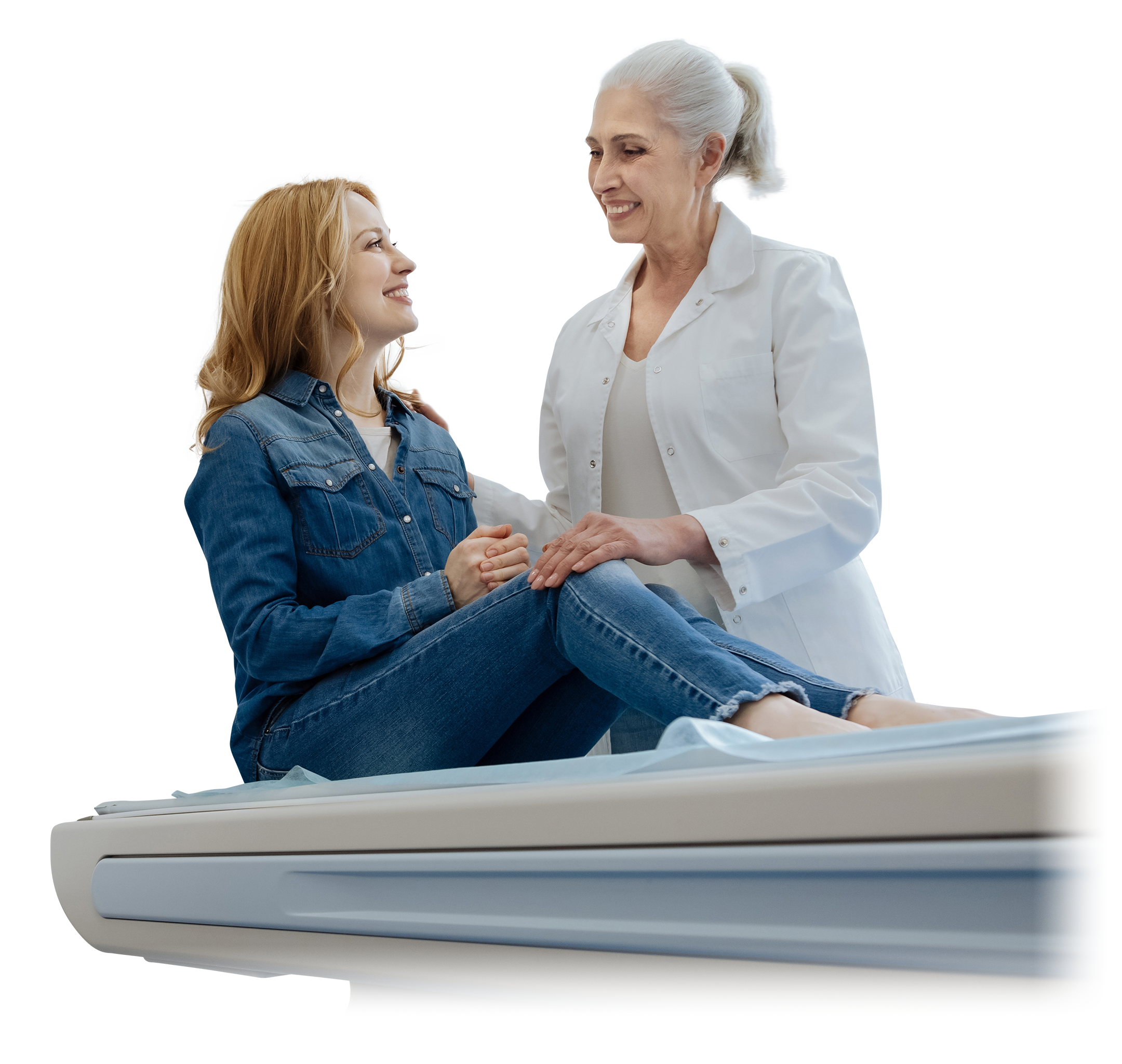 Photograph of an older, female doctor talking to a middle age female representing a patient with systemic sclerosis. 