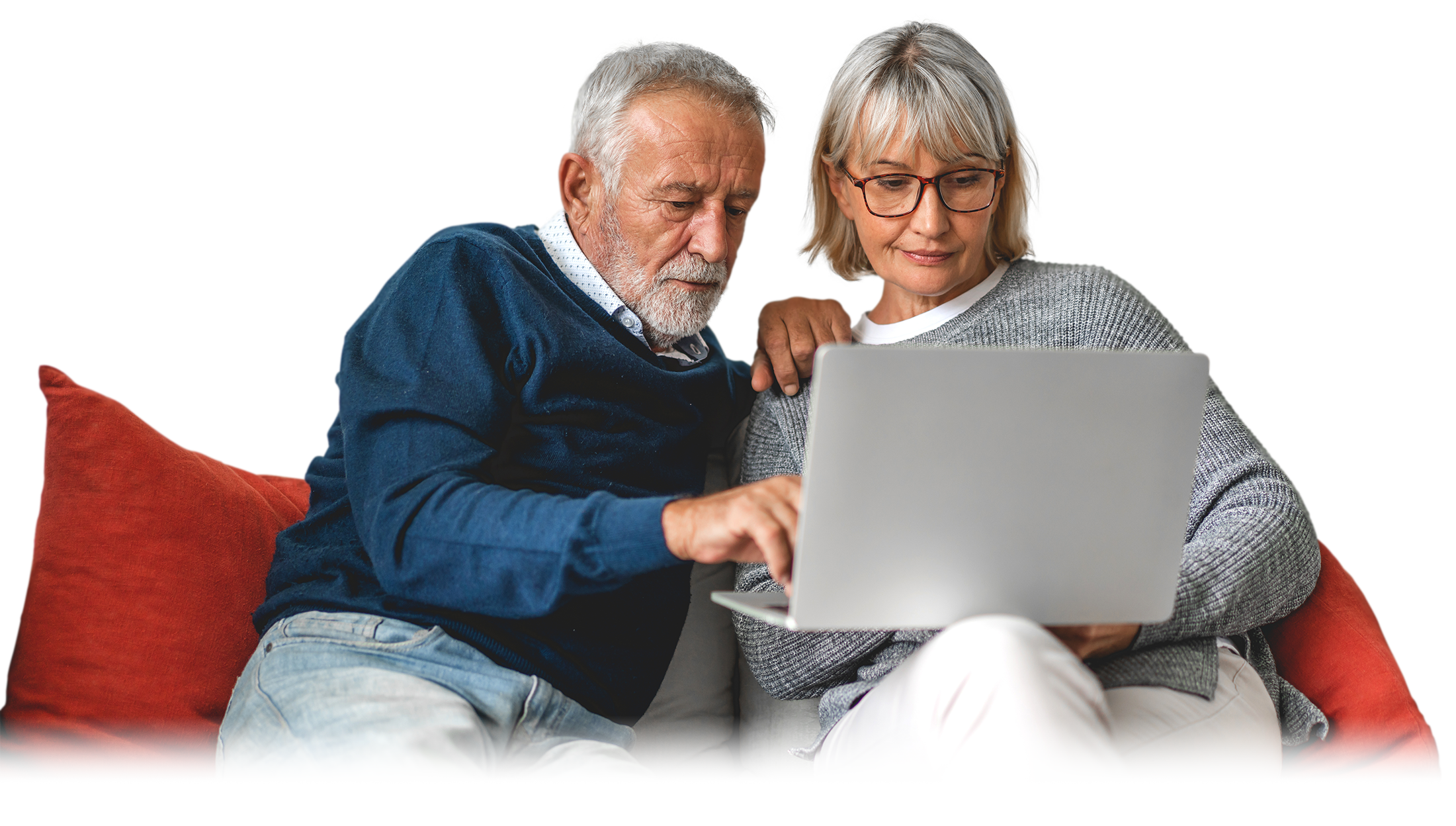 Photograph of an older, Caucasian couple on a couch reading online about the BLISSc-ILD Study and systemic sclerosis. 